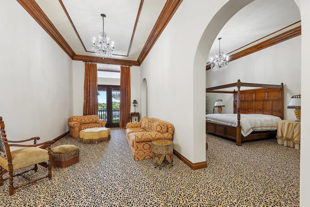 a living room with furniture and flowers