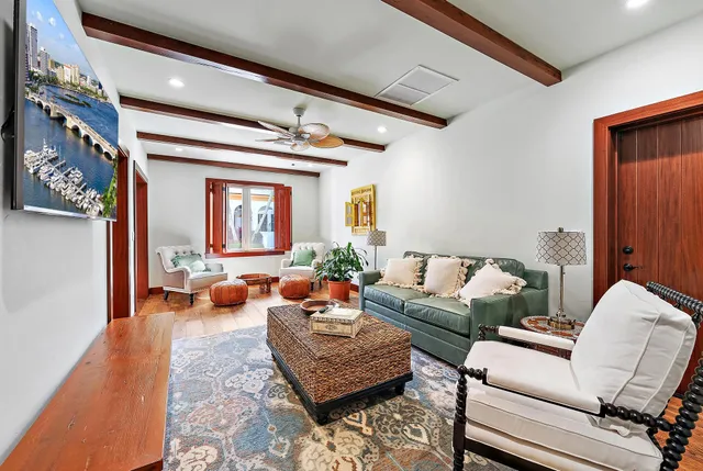 a bedroom with a bed couch and dresser