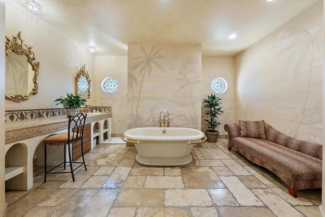 a bathroom with a mirror and a shower