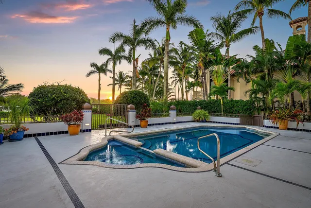a view of swimming pool with chairs