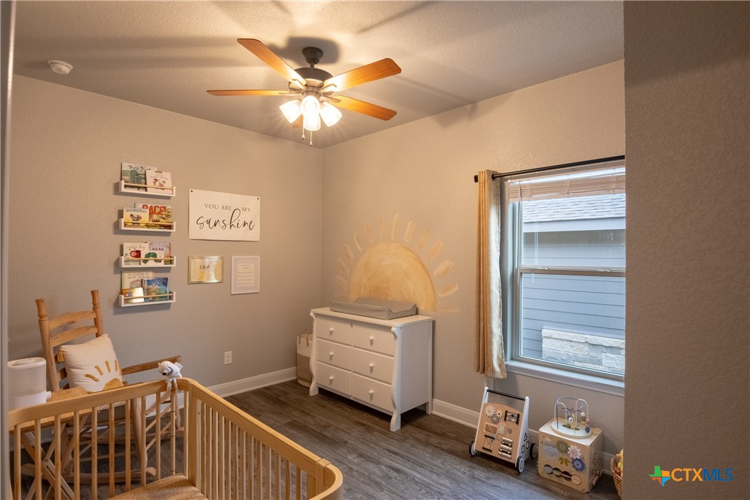 7909 McCulloch Road Temple, TX 76502 - Photo 4 of 46 a room with chair and wooden floor
