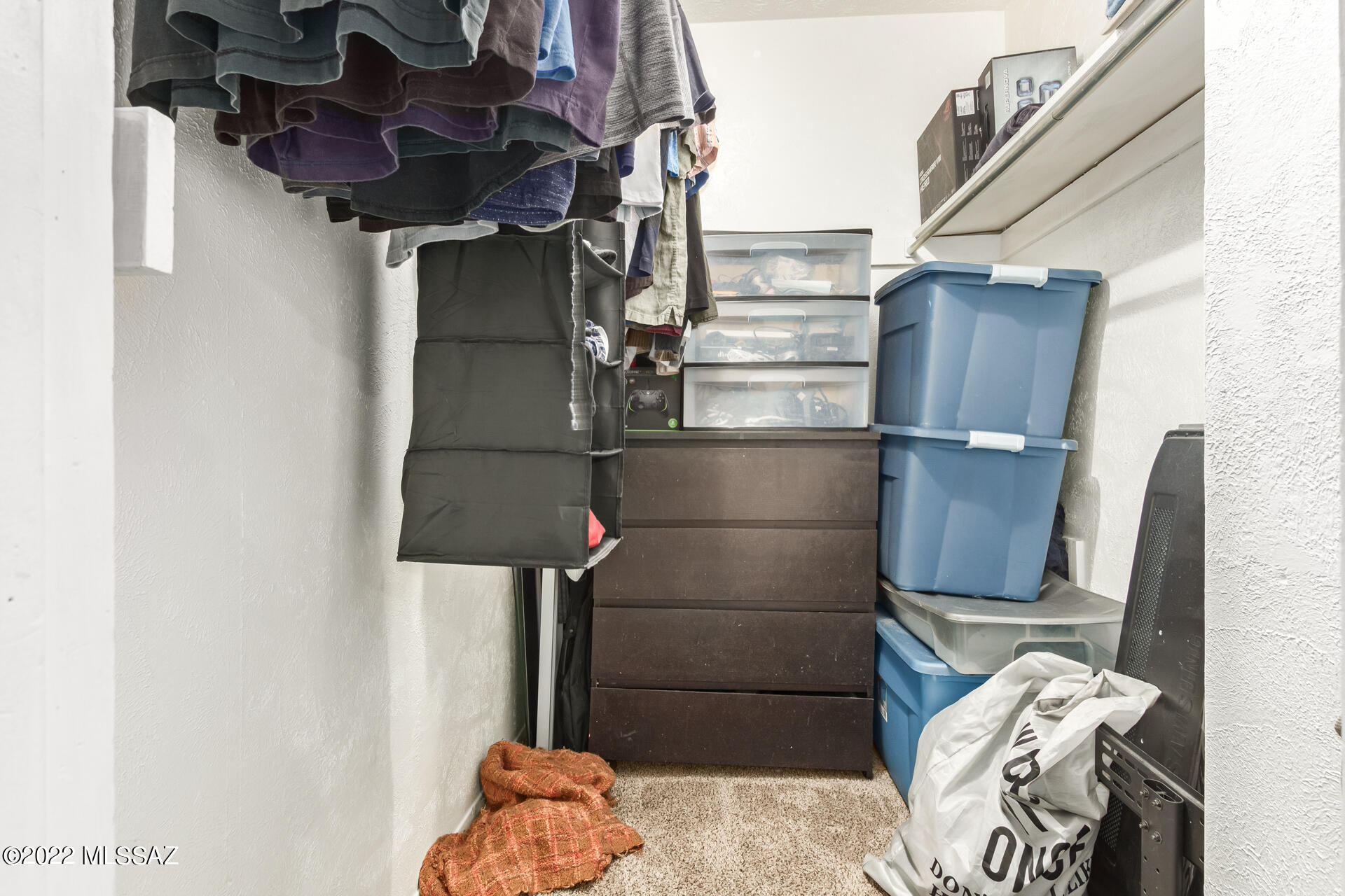 1620 North Wilmot Road, Unit D273 Tucson, AZ 85712 - Photo 11 of 15 a close view of walk in closet