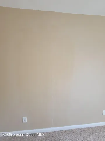 a view of a livingroom with a large window