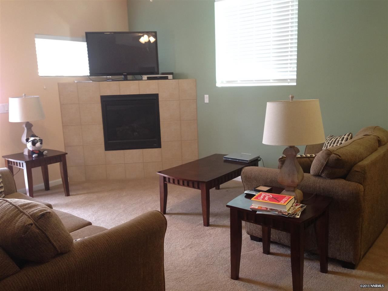 1405 Humboldt Street Reno, NV 89509 - Photo 1 of 1 a living room with furniture and a flat screen tv