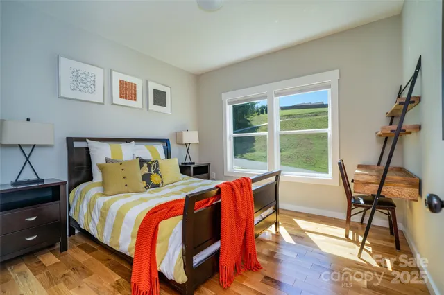 a bed room with a bed and a chair