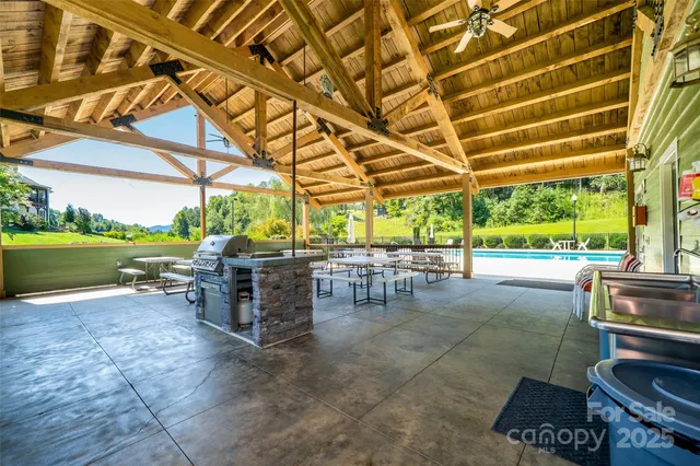 a view of a patio with table and chairs and potted plants