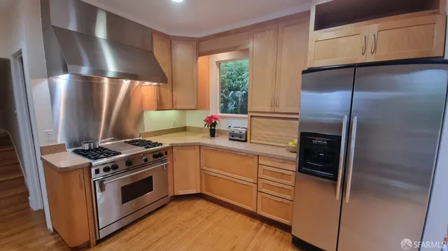 a living room with furniture a fireplace and a table