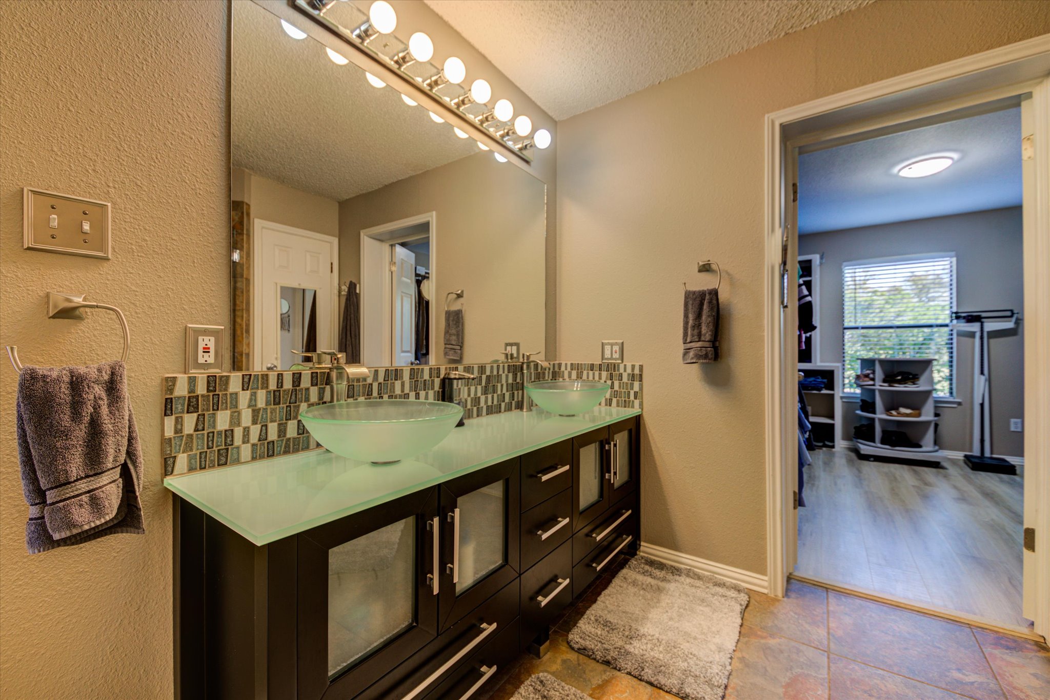 200 Harbor Circle Georgetown, TX 78633 - Photo 14 of 38 a bathroom with a sink a double vanity and a mirror
