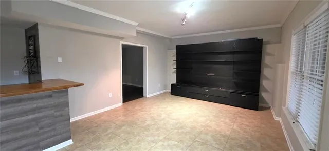 a view of an empty room and window