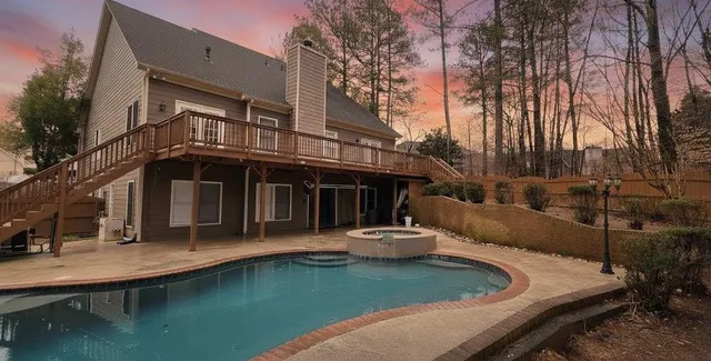 a view of balcony with wooden floor and fence