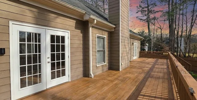 a house view with swimming pool in front of it