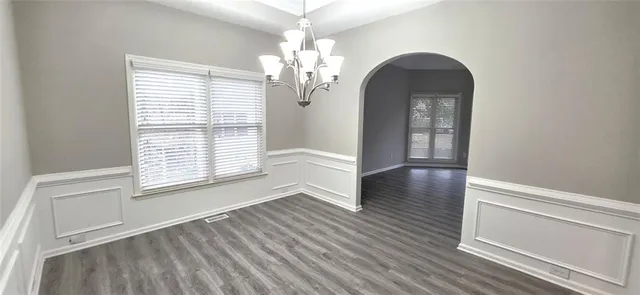a view of a livingroom with wooden floor
