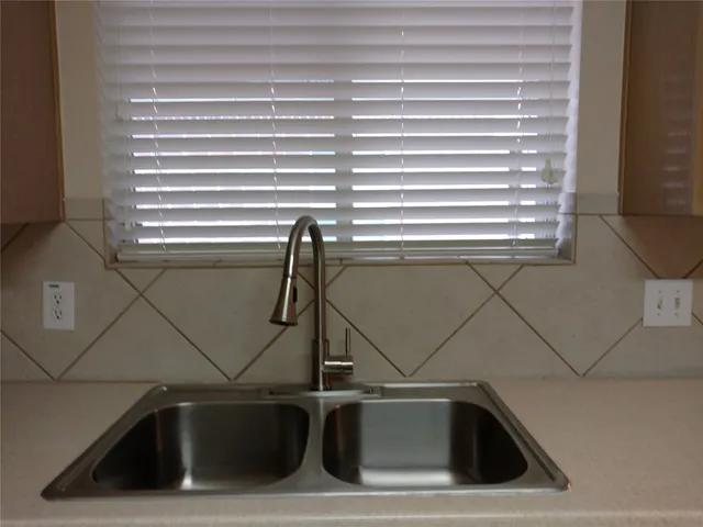a close view of sink and a window
