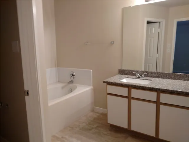 a bathroom with a sink and a bathtub