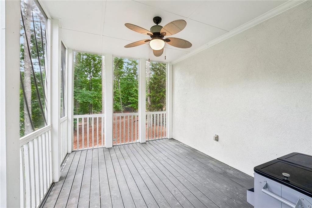 1091 Fieldstone Trail Milton, GA 30004 - Photo 65 of 84 a view of an empty room with wooden floor and a window