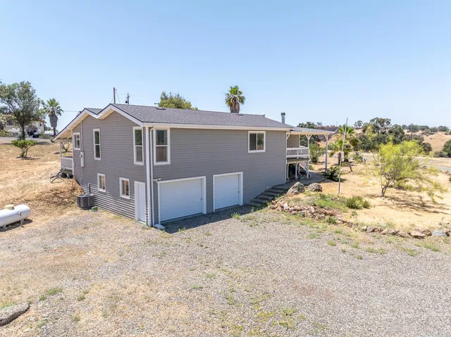 a view of a house with a snow in the background