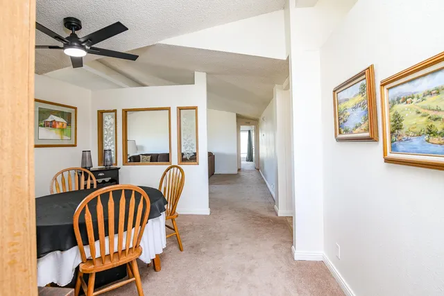 a balcony with table and chairs