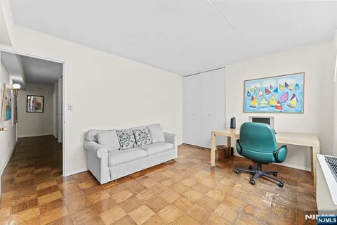 a view of workspace with furniture and window