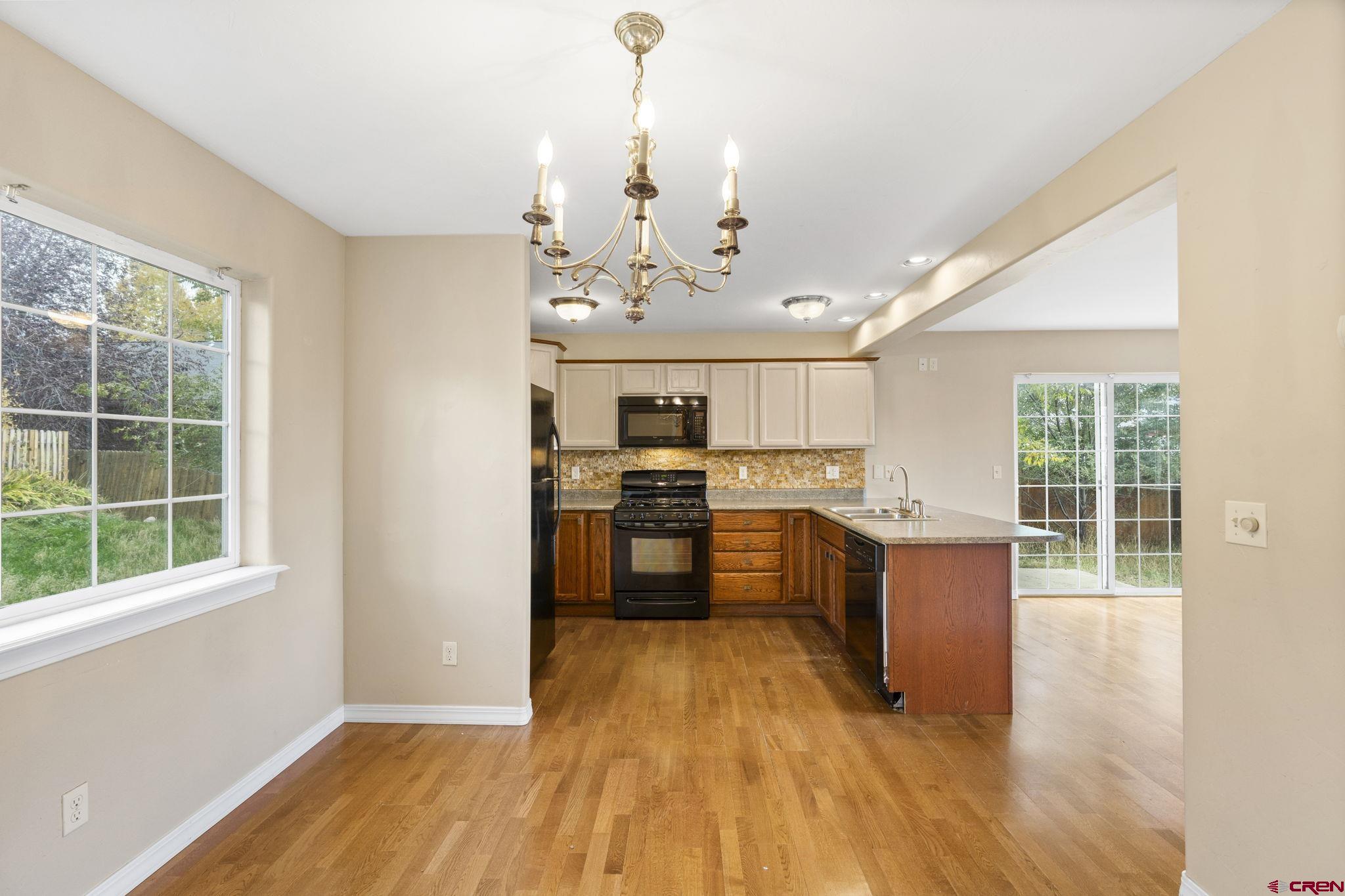 724 Jacobs Lane Bayfield, CO 81122 - Photo 13 of 33 a view of a kitchen with a sink and wooden floor