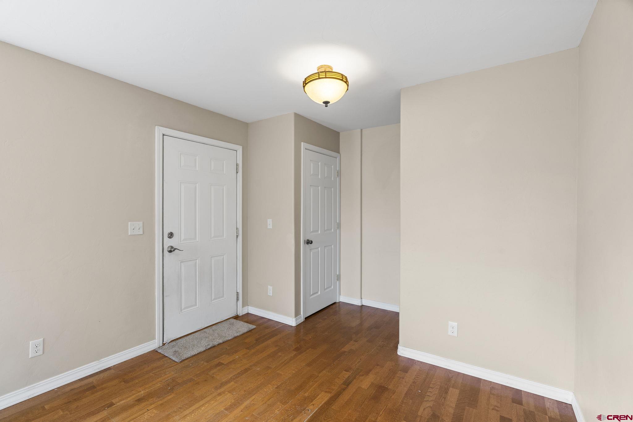 724 Jacobs Lane Bayfield, CO 81122 - Photo 15 of 33 a view of an empty room and wooden floor