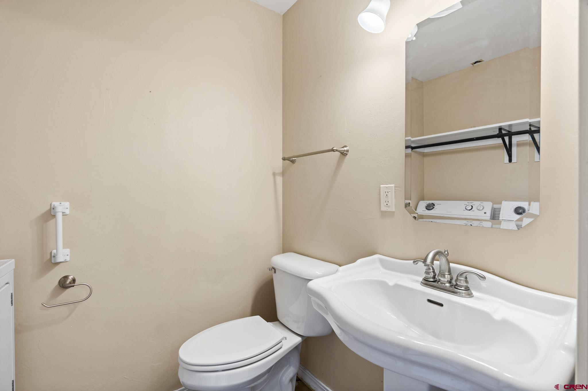 724 Jacobs Lane Bayfield, CO 81122 - Photo 20 of 33 a bathroom with a sink a toilet and a mirror