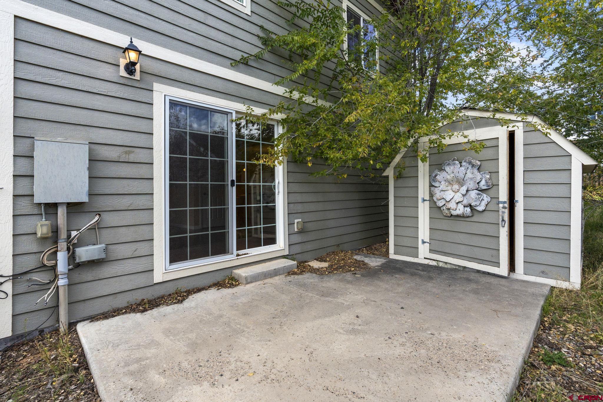 724 Jacobs Lane Bayfield, CO 81122 - Photo 27 of 33 a view of a house with a door and wooden walls
