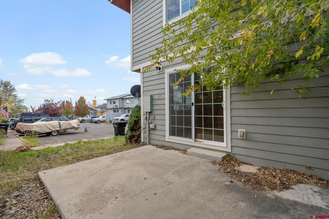 a view of a house with a yard and garage