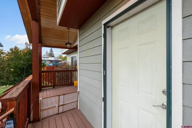 a view of balcony with wooden floor
