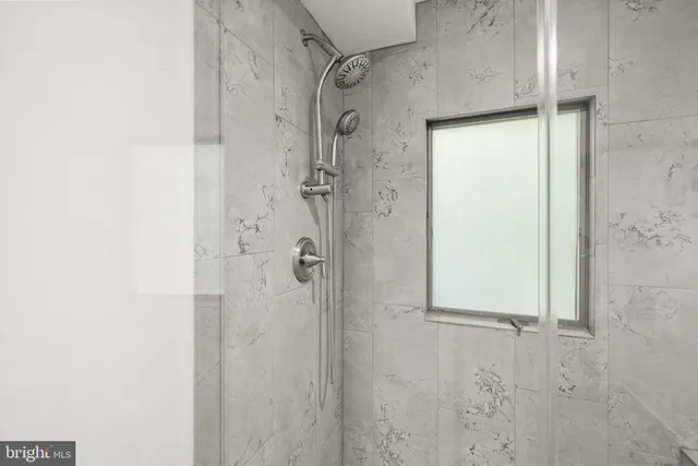 a view of a livingroom with wooden floor and furniture