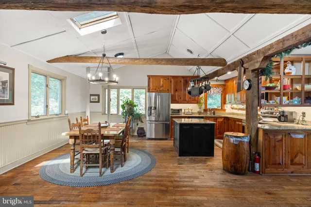a kitchen with stainless steel appliances granite countertop a stove and refrigerator