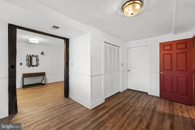 a view of a livingroom with wooden floor