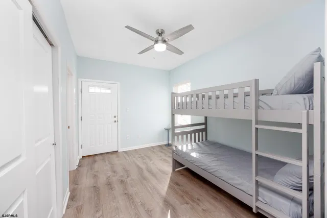 a bathroom with a sink toilet and window