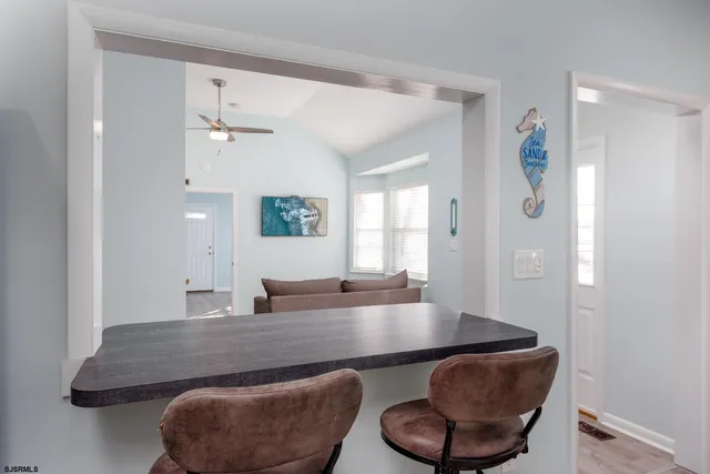 a living room with kitchen island furniture and a window