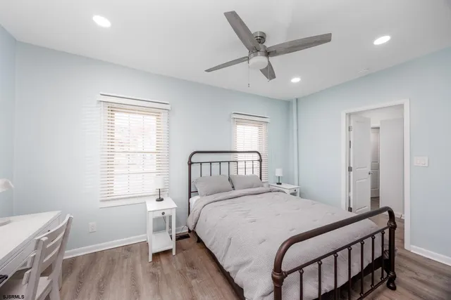 a bedroom with a large bed and a window