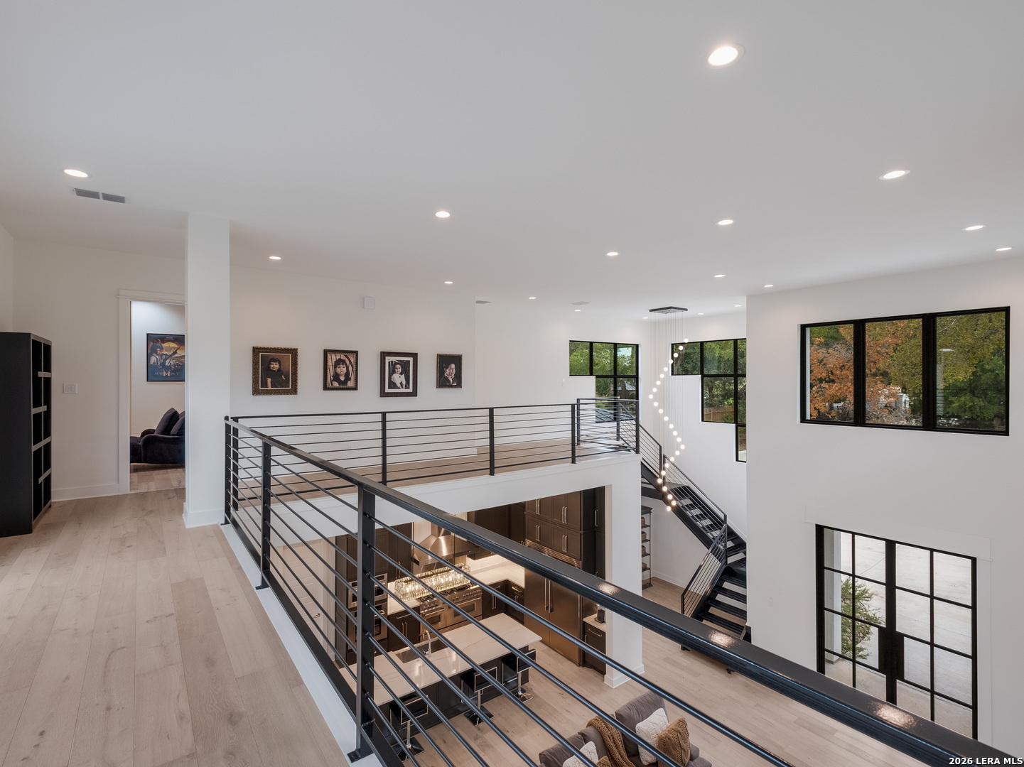 1053 Brewer Rdg Road Bulverde, TX 78163 - Photo 18 of 37 a view of a hallway with wooden floor and stairs