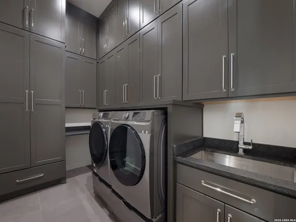 a utility room with cabinets