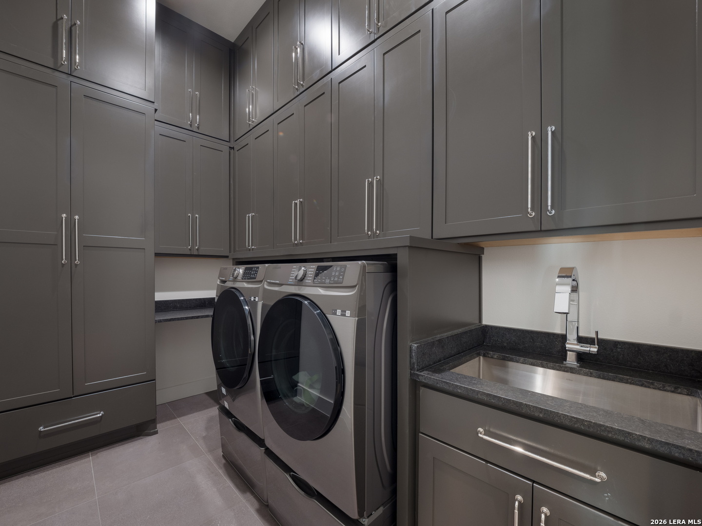 1053 Brewer Rdg Road Bulverde, TX 78163 - Photo 22 of 37 a utility room with cabinets