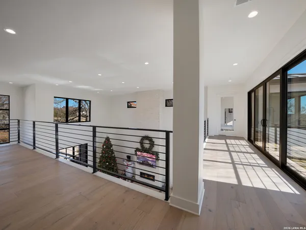 a view of a hallway with seating area