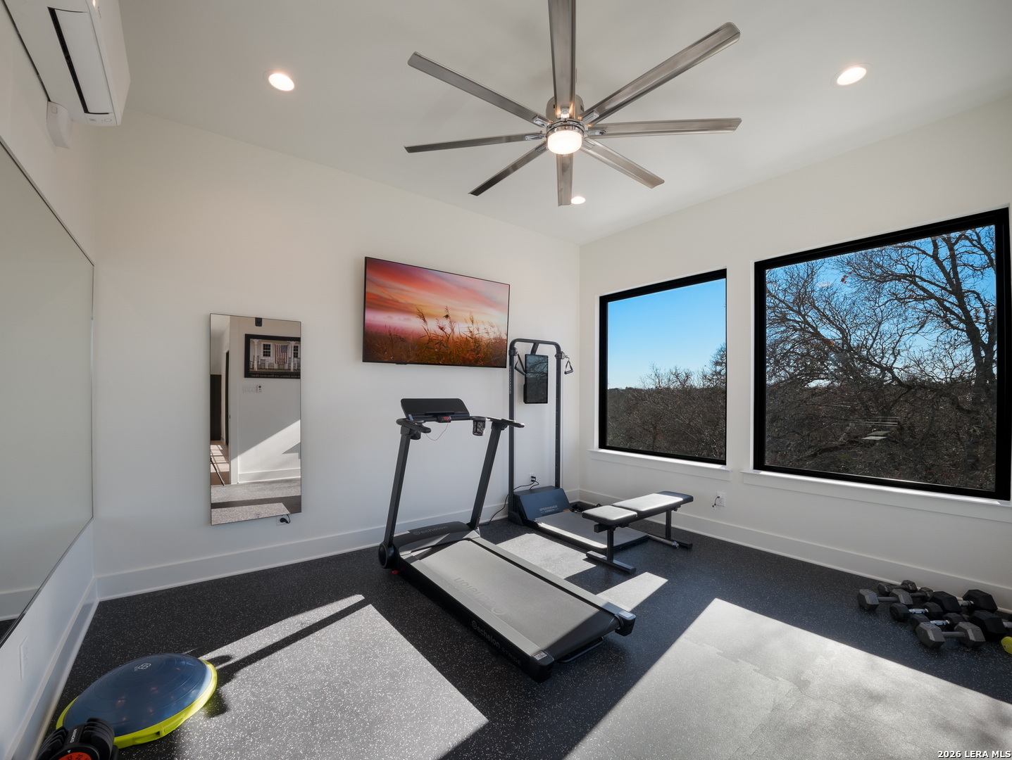 1053 Brewer Rdg Road Bulverde, TX 78163 - Photo 24 of 37 a living room with furniture and a flat screen tv