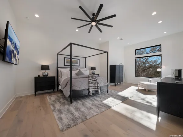 a bedroom with furniture and a window