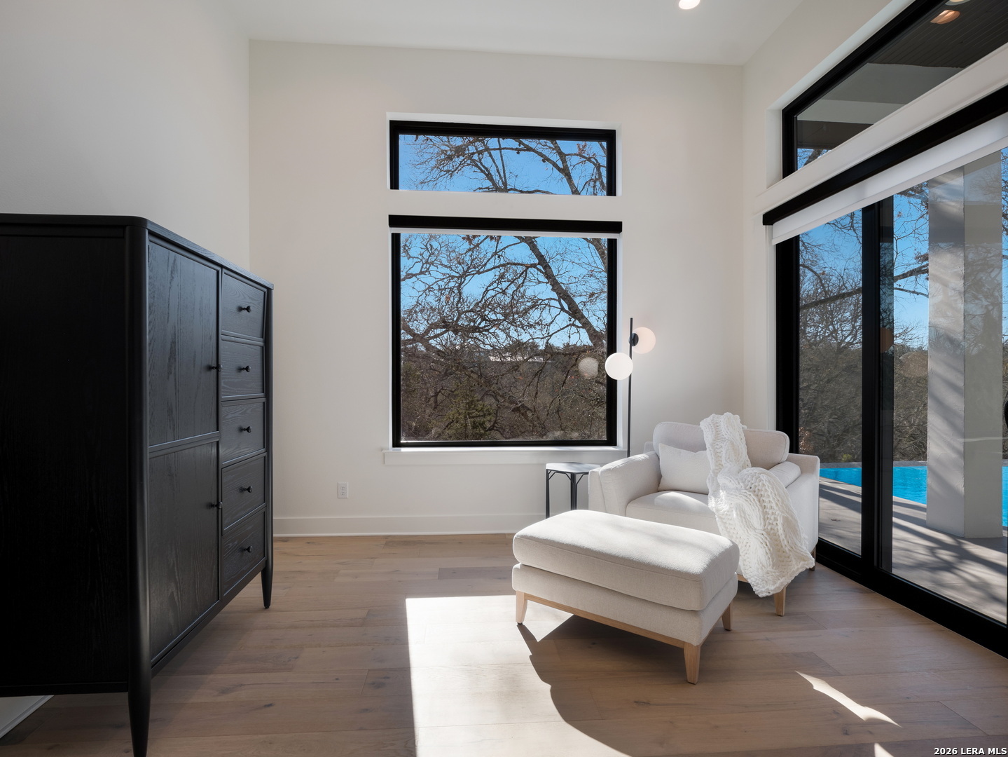1053 Brewer Rdg Road Bulverde, TX 78163 - Photo 29 of 37 a living room with furniture a large window and a glass door