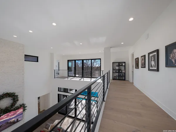 a hallway with furniture and window
