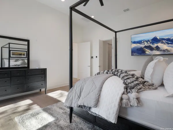 a bedroom with a bed and a dresser