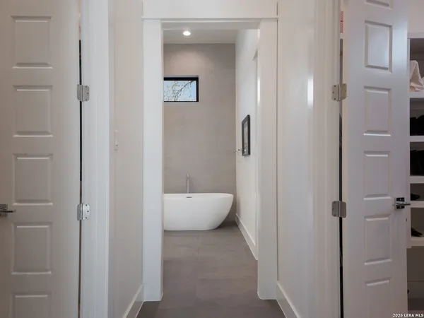 a bathroom with a tub and shower