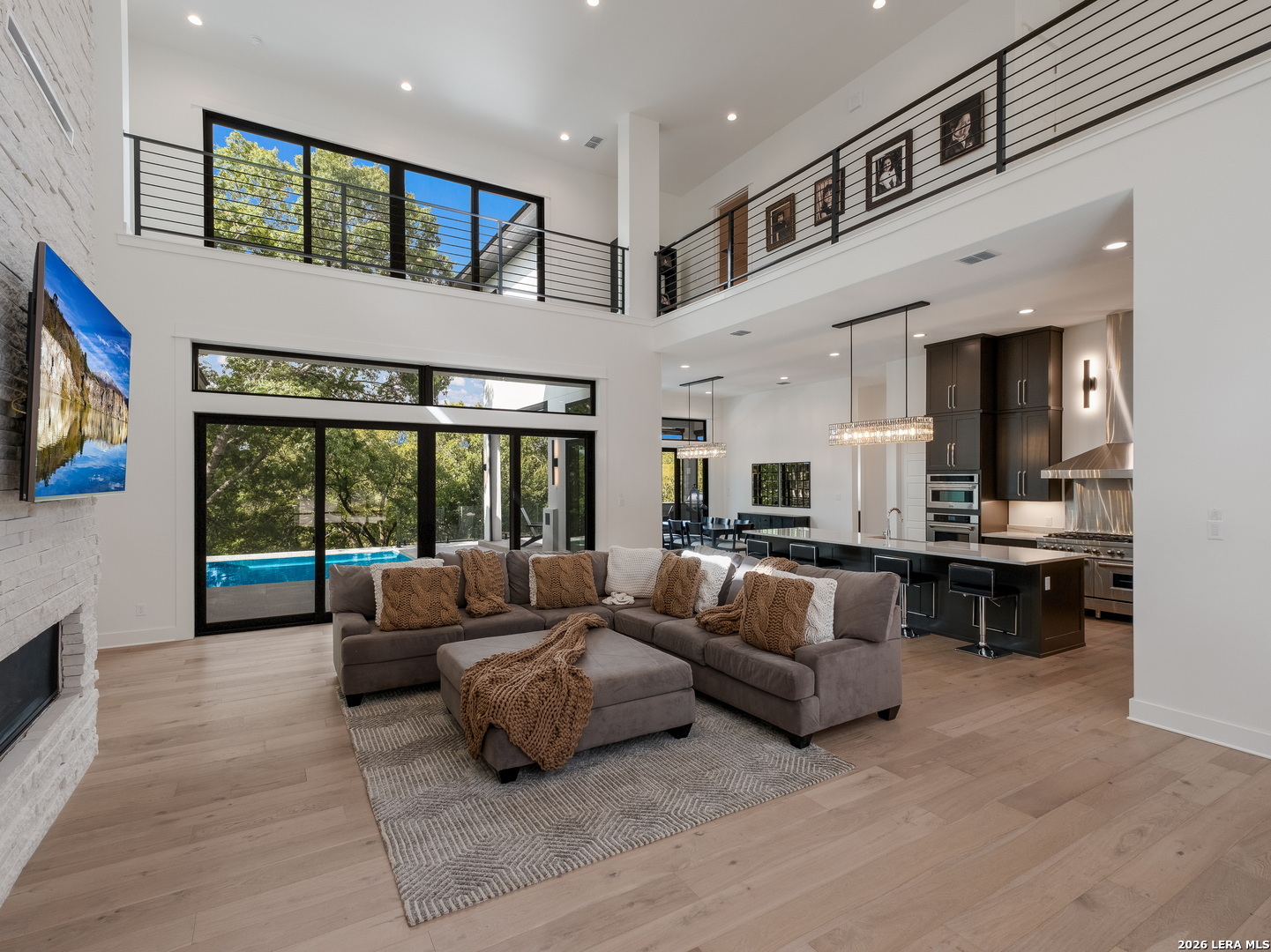 1053 Brewer Rdg Road Bulverde, TX 78163 - Photo 5 of 37 a living room with furniture and a flat screen tv