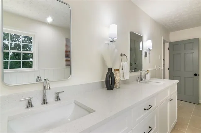 a white toilet sitting next to a bathroom sink