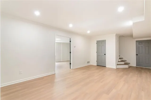 a bathroom with a sink toilet vanity and shower