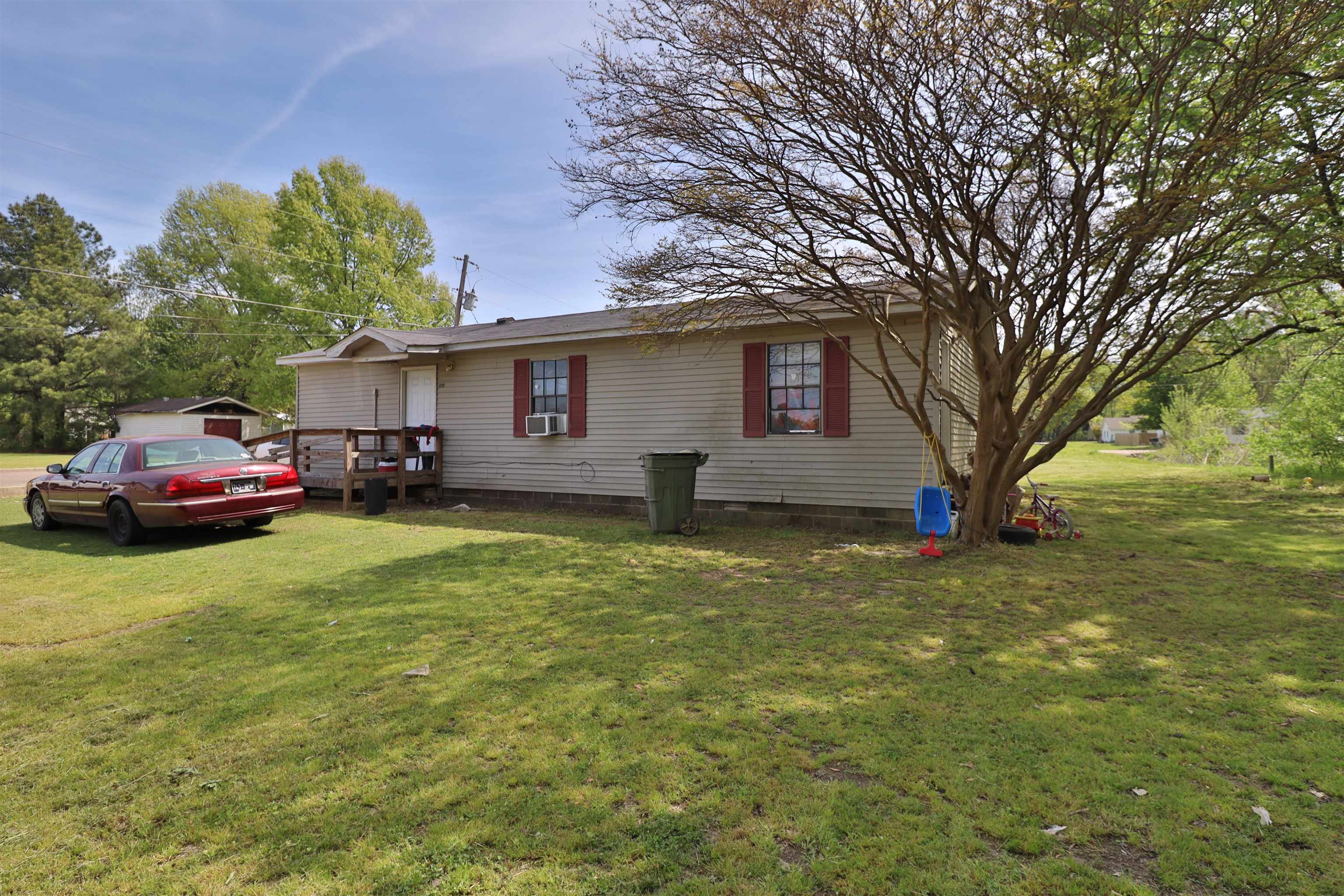 319 Wayne Avenue Ripley, TN 38063 - Photo 7 of 10 a front view of a house with garden
