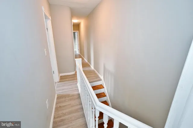 a view of a hallway with staircase