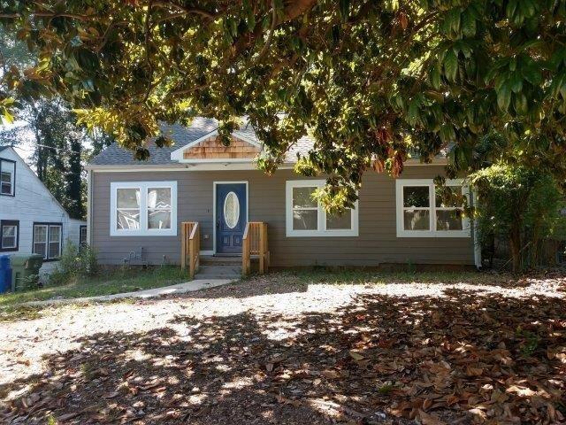 175 Mathewson Place Southwest Atlanta, GA 30314 - Photo 1 of 1 a front view of a house with a garden